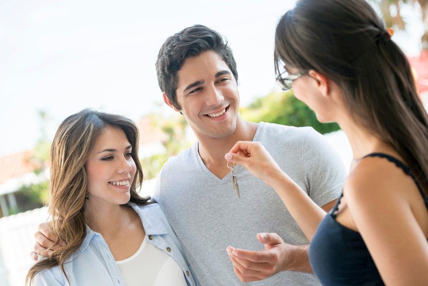 young-couple-gets-keys-to-a-house.jpg