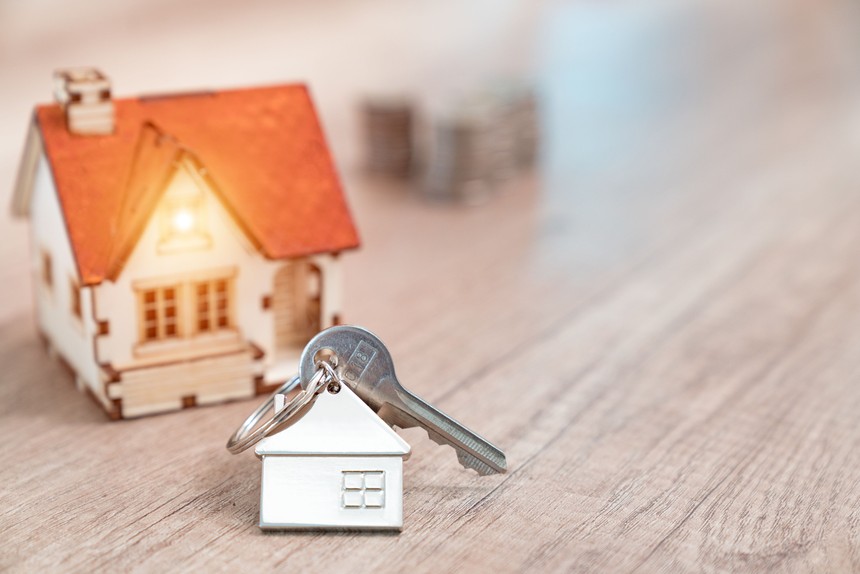 house-key-on-a-house-shaped-keychain-resting-on-wooden-floorboards-concept-for-real-estate--moving-home-or-renting-property-869184688-5a89d8a1119fa8003737b44f.jpg